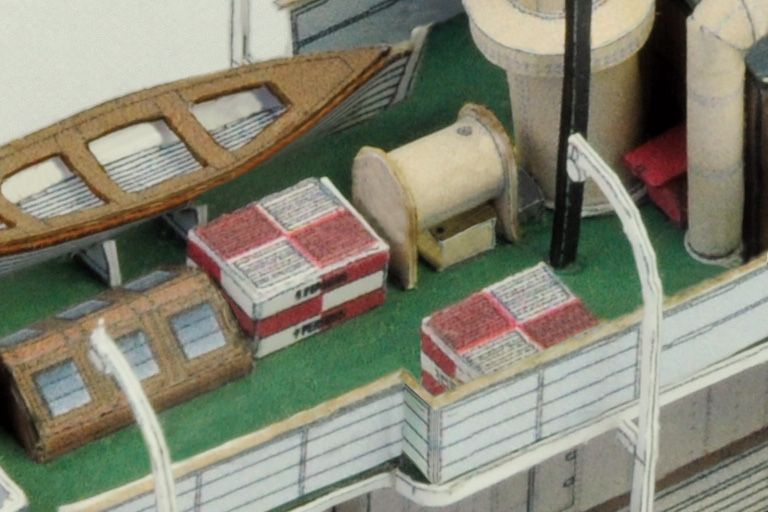 Photo of the HMV 1/250 scale Steam Tug Waratah paper model kit showing detailed deck design, filigree masts, and bridge interior.