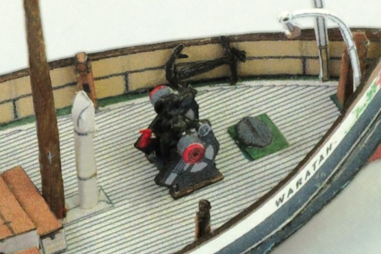 Photo of the HMV 1/250 scale Steam Tug Waratah paper model kit showing detailed deck design, filigree masts, and bridge interior.