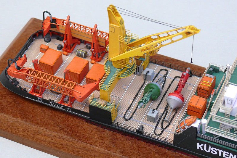 Photo of the HMV Multipurpose Vessel Mellum card model kit in 1:250 scale, showing detailed superstructure, movable crane, and coast guard equipment