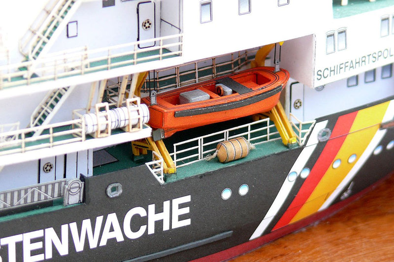 Photo of the HMV Multipurpose Vessel Mellum card model kit in 1:250 scale, showing detailed superstructure, movable crane, and coast guard equipment