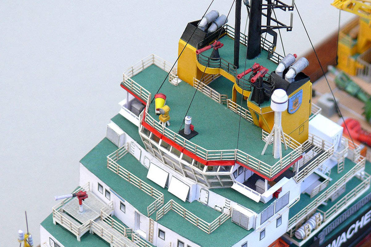 Photo of the HMV Multipurpose Vessel Mellum card model kit in 1:250 scale, showing detailed superstructure, movable crane, and coast guard equipment