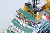 Photo of the HMV Multipurpose Vessel Mellum card model kit in 1:250 scale, showing detailed superstructure, movable crane, and coast guard equipment