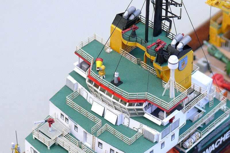 Photo of the HMV Multipurpose Vessel Mellum card model kit in 1:250 scale, showing detailed superstructure, movable crane, and coast guard equipment