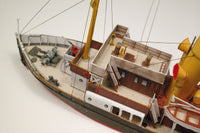 Photo of HMV Merkur and Vulkan 1/250 scale tugboat card model kit showing detailed steam tugs with printed parts and maritime accessories.