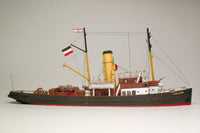 Photo of HMV Merkur and Vulkan 1/250 scale tugboat card model kit showing detailed steam tugs with printed parts and maritime accessories.