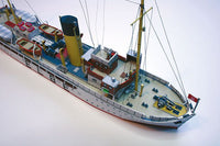 Photo of HMV Pilot Boat Ditmar Koel 1:250 scale paper model kit showing detailed parts and completed model of the 1935 German pilot vessel.
