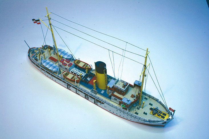 Photo of HMV Pilot Boat Ditmar Koel 1:250 scale paper model kit showing detailed parts and completed model of the 1935 German pilot vessel.