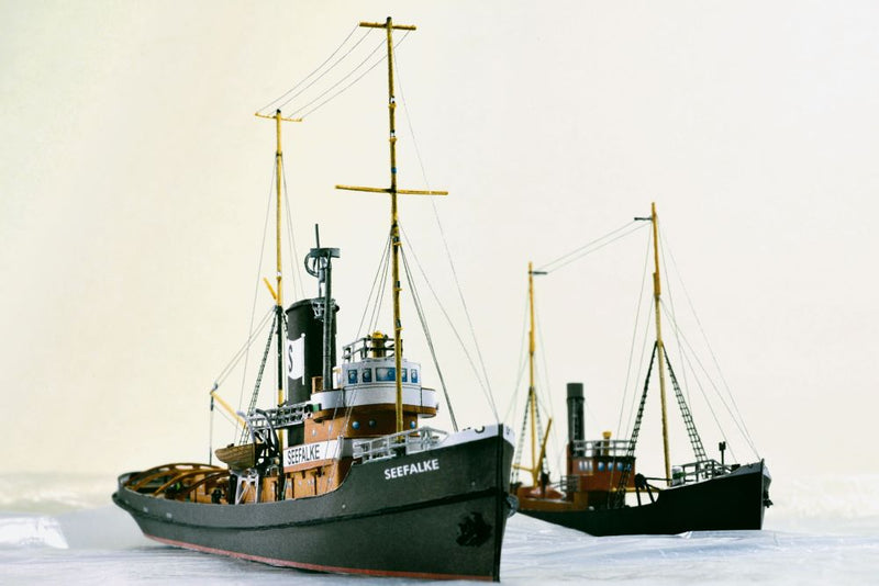 Photo of the HMV card model kit of the 1924 salvage tug Seefalke in 1:250 scale with trawler Lappland and tug Scheelenkuhlen.