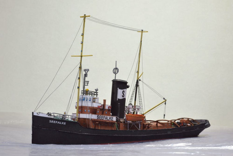 Photo of the HMV card model kit of the 1924 salvage tug Seefalke in 1:250 scale with trawler Lappland and tug Scheelenkuhlen.