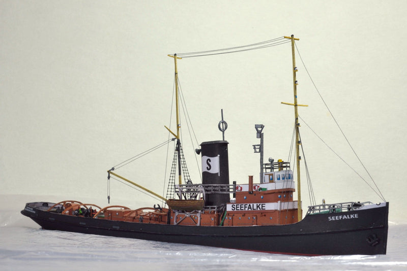Photo of the HMV card model kit of the 1924 salvage tug Seefalke in 1:250 scale with trawler Lappland and tug Scheelenkuhlen.