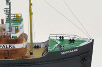 Photo of the HMV card model kit of the 1924 salvage tug Seefalke in 1:250 scale with trawler Lappland and tug Scheelenkuhlen.