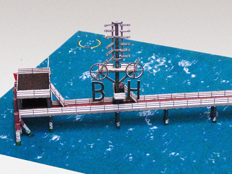 Photo of HMV Hohe Weg Aussenweser Lighthouse 1:250 card model kit showing detailed paper parts, wind semaphore, and water base.
