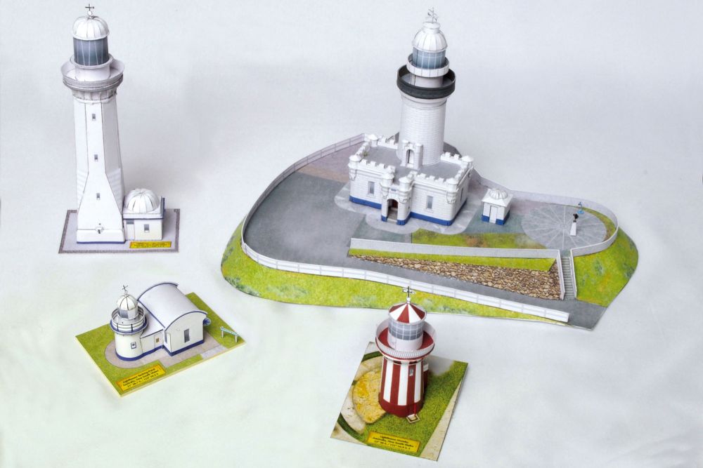 Photo of HMV Lighthouses of the World – Australia card model kit featuring four detailed Australian lighthouse models on display bases