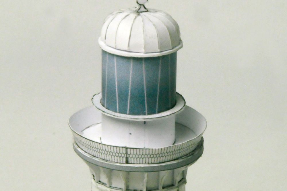 Photo of HMV Lighthouses of the World – Australia card model kit featuring four detailed Australian lighthouse models on display bases