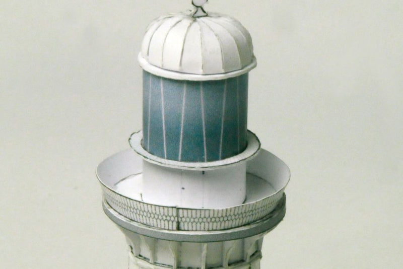 Photo of HMV Lighthouses of the World – Australia card model kit featuring four detailed Australian lighthouse models on display bases