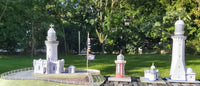 Photo of HMV Lighthouses of the World – Australia card model kit featuring four detailed Australian lighthouse models on display bases