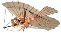 Photo of the M.S. Oldtimer-Models Weisskopf 1901 card model kit by HMV, showing the detailed colored cardboard sheets and finished airplane model in 1:50 scale.