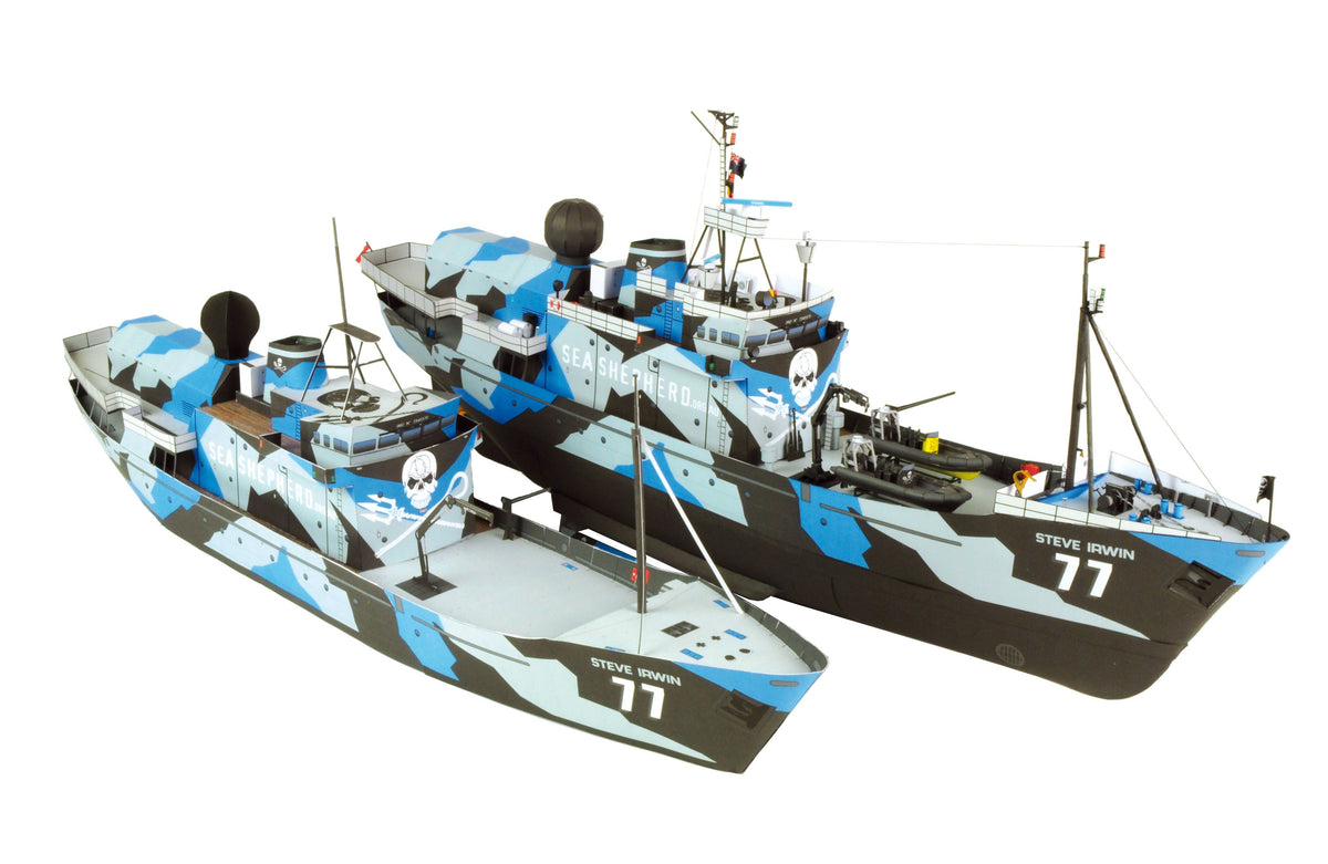Two remote control model fishing boats with a blue, gray, and black camouflage pattern, featuring a skull and crossbones logo and the name 'STIVE RAWIN 77' on the hulls, shown against a solid white background.