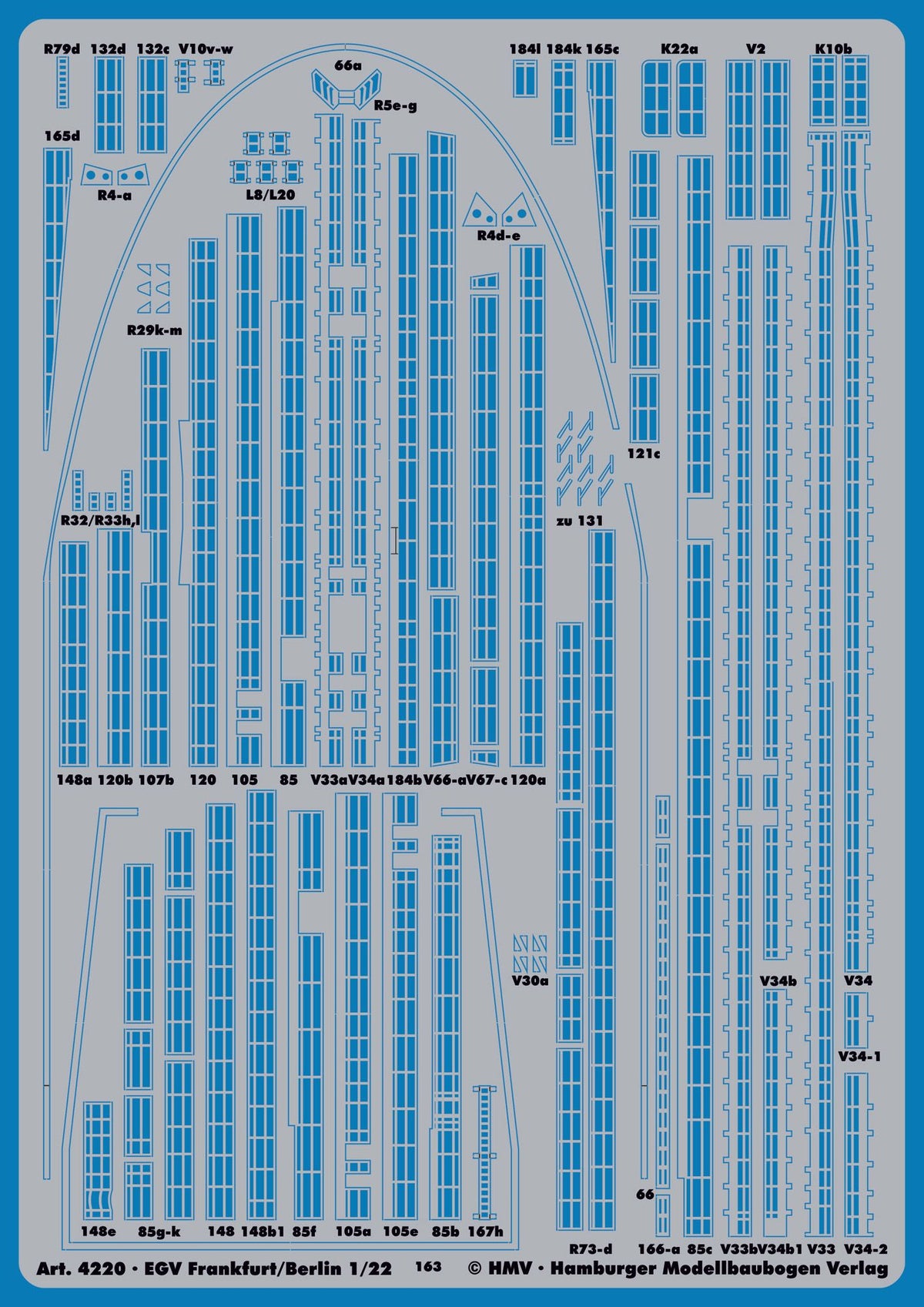 A blue and white plastic model train decal sheet from KMW (Hamburger Modellbaufen Verlag), featuring various printed labels, numbers, and markings for model trains, with text indicating scale 1:22.