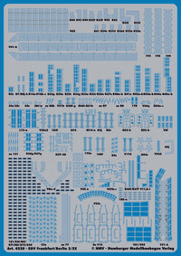 A blue model kit decal sheet featuring numerous small printed architectural and vehicle layout templates with alphanumeric codes, shown on a white background.