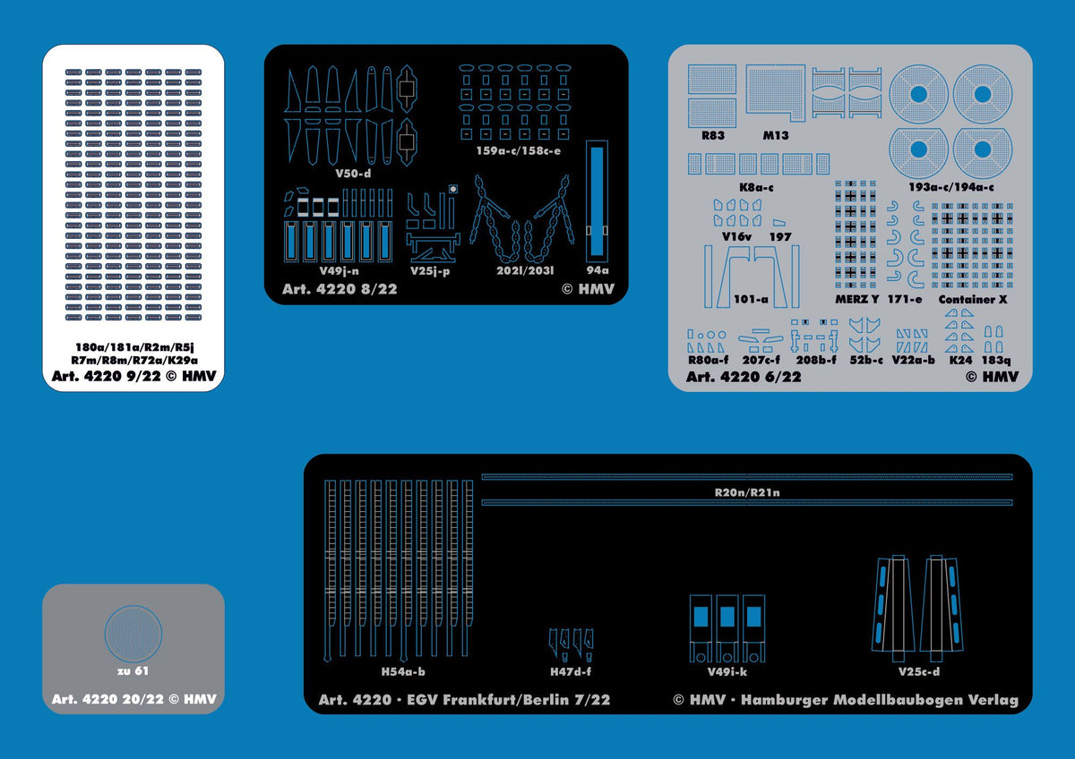 A blue sheet showing multiple printed decal or model kit parts arranged in a grid, including black, white, and gray rectangular panels with technical markings and labels. The sheet includes visible text such as 'Art.