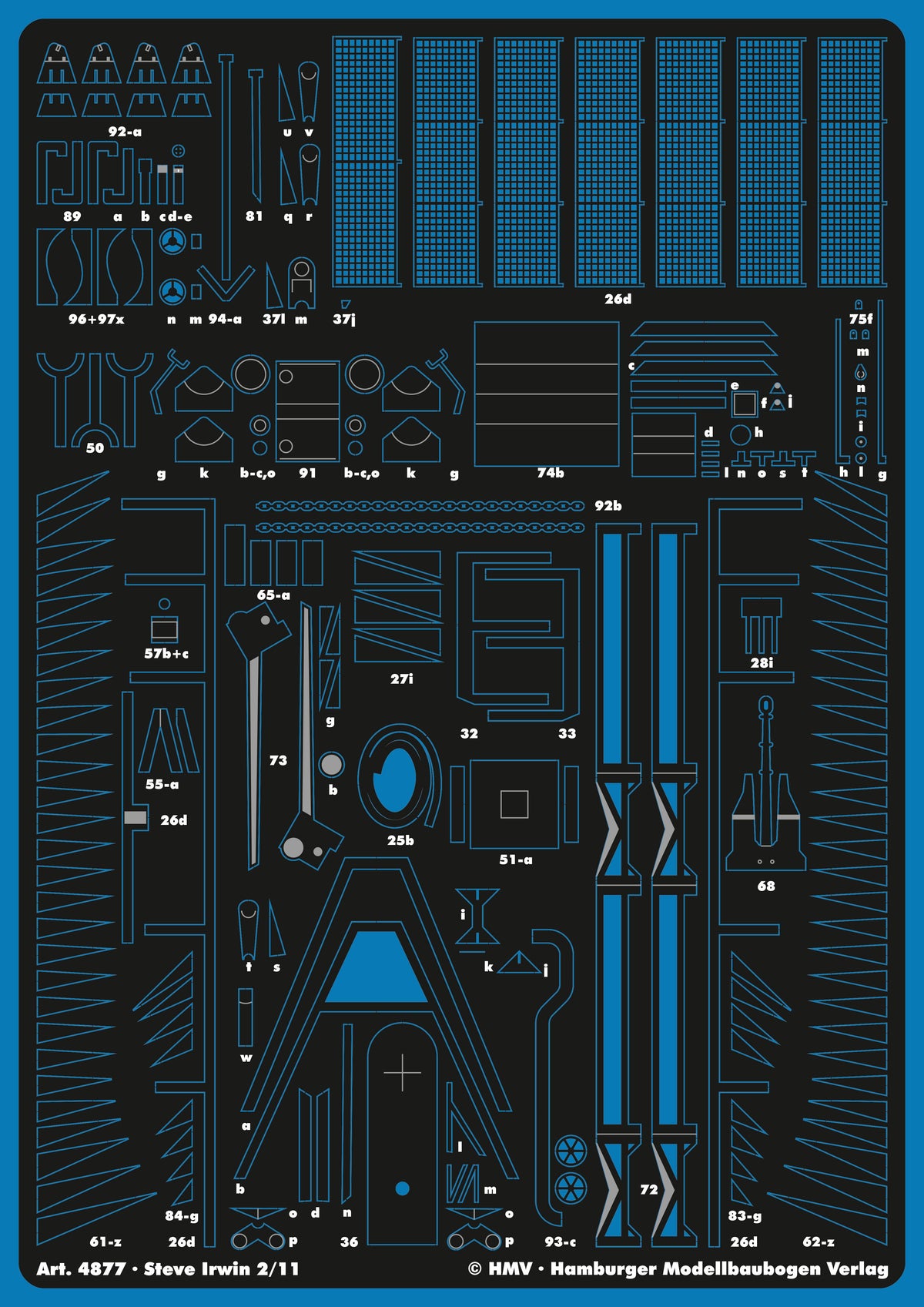 A sheet of blue plastic model kit parts on a black backing, labeled with part numbers and markings for Steve Irwin from 2/11 scale. The sheet includes various small molded components such as grids, panels, and structural pieces.