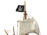 Photo of OcCre Buccaneer Pirate Ship 1:100 Wooden Model Kit fully assembled, showing detailed sails, wooden hull, and rigging.