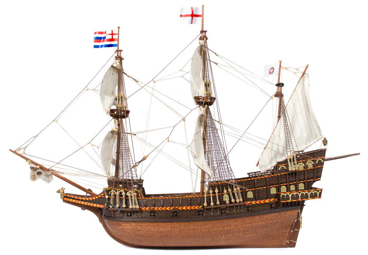 Photo of OcCre Golden Hind 1:85 wooden model ship kit showing detailed wooden hull and historical galleon design.
