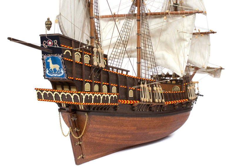 Photo of OcCre Golden Hind 1:85 wooden model ship kit showing detailed wooden hull and historical galleon design.