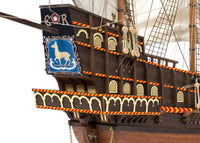 Photo of OcCre Golden Hind 1:85 wooden model ship kit showing detailed wooden hull and historical galleon design.