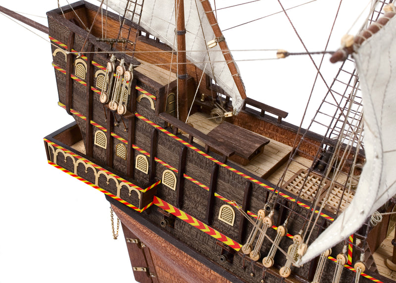 Photo of OcCre Golden Hind 1:85 wooden model ship kit showing detailed wooden hull and historical galleon design.