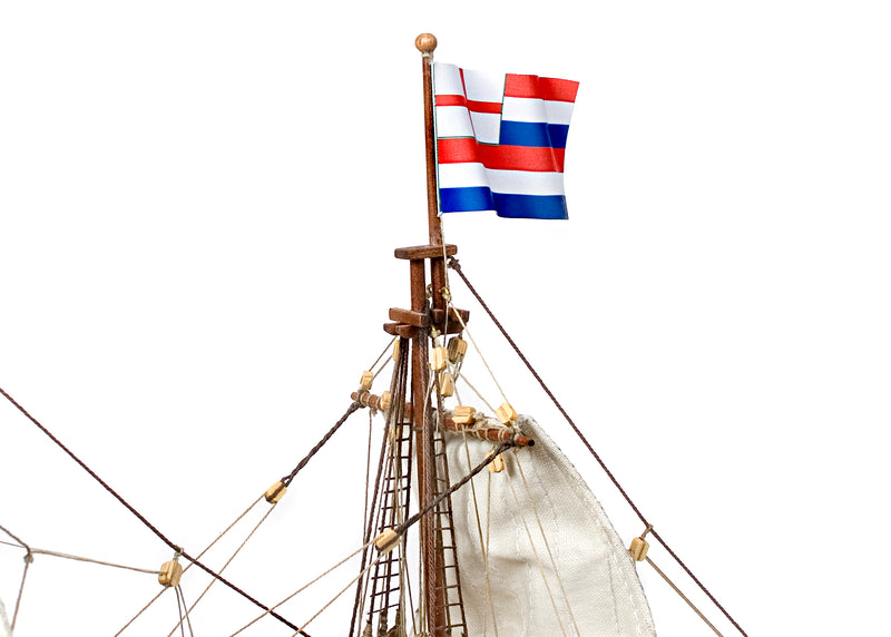 Photo of OcCre Golden Hind 1:85 wooden model ship kit showing detailed wooden hull and historical galleon design.