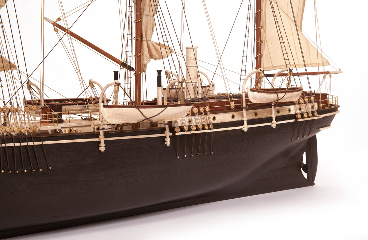 Photo of OcCre Endurance 1:70 wooden model ship kit with sails, nameplate, and detailed wooden construction