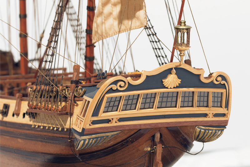 Photo of the La Candelaria 1:85 wooden model ship kit by OcCre showcasing detailed hull, masts and deck features