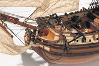 Photo of the La Candelaria 1:85 wooden model ship kit by OcCre showcasing detailed hull, masts and deck features