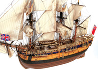 Photo of the OcCre Endeavour wooden model ship kit at 1:54 scale, fully assembled with detailed rigging and sails.
