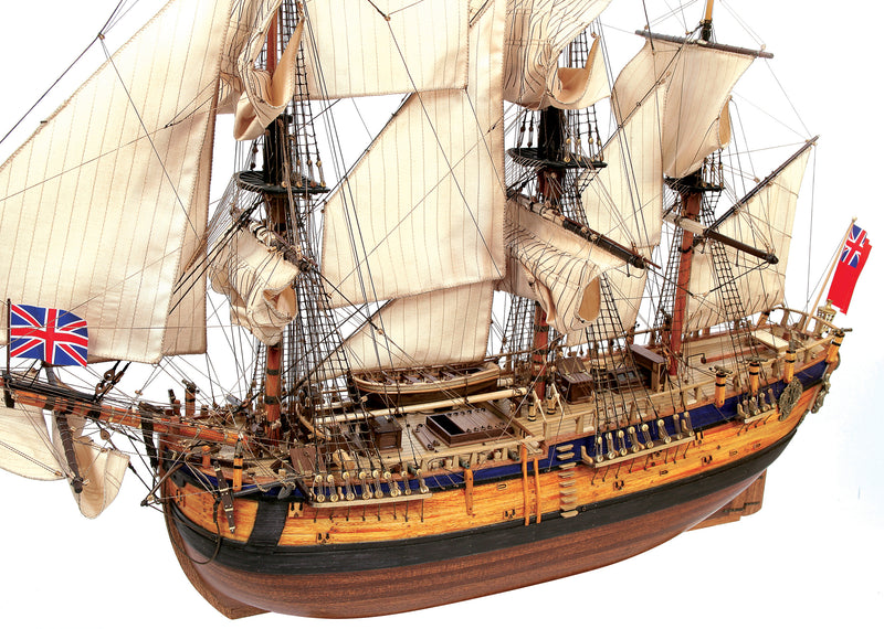 Photo of the OcCre Endeavour wooden model ship kit at 1:54 scale, fully assembled with detailed rigging and sails.