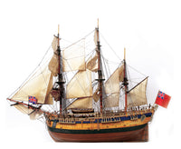 Photo of the OcCre Endeavour wooden model ship kit at 1:54 scale, fully assembled with detailed rigging and sails.
