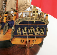 Photo of the OcCre Endeavour wooden model ship kit at 1:54 scale, fully assembled with detailed rigging and sails.