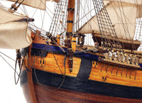 Photo of the OcCre Endeavour wooden model ship kit at 1:54 scale, fully assembled with detailed rigging and sails.