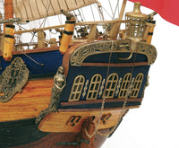 Photo of the OcCre Endeavour wooden model ship kit at 1:54 scale, fully assembled with detailed rigging and sails.