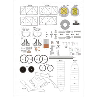 A sheet of printed model boat parts laid out on a white background, including templates, decals, and small component pieces with printed labels and measurements.