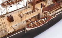 Photo of OcCre Endurance 1:70 wooden model ship kit with sails, nameplate, and detailed wooden construction