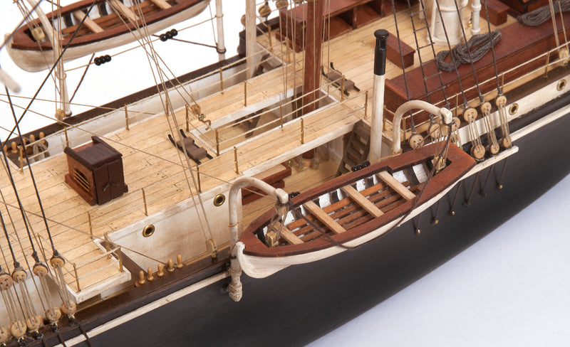 Photo of OcCre Endurance 1:70 wooden model ship kit with sails, nameplate, and detailed wooden construction