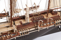 Photo of OcCre Endurance 1:70 wooden model ship kit with sails, nameplate, and detailed wooden construction