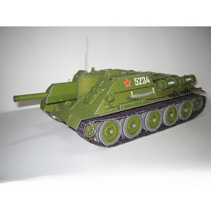 An olive green model or miniature tank with white markings, a red star, and the number 5234, photographed on a plain light background.