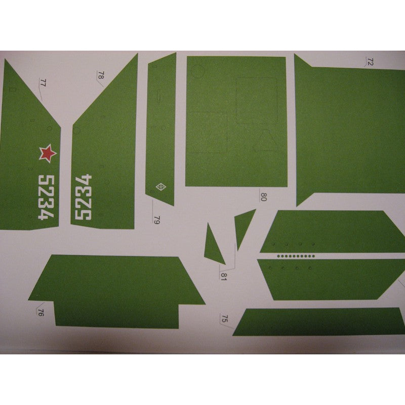 A sheet of green decal pieces with printed markings, including the number 5234, 4325, and small red star details, laid out on a white background.