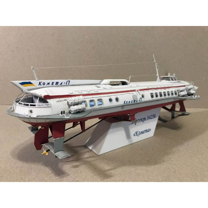A detailed model of the Soviet passenger ship Kometa-17, displayed on a white stand against a neutral beige background.