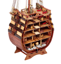 Photo of the Santísima Trinidad cross-section model kit by OcCre in 1/90 scale, showcasing detailed inner ship structure and mainmast elements.