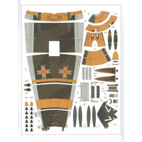 A flat lay of printed paper craft pieces for assembling a model aircraft, shown on a white background with numbered sections and small German cross insignias.